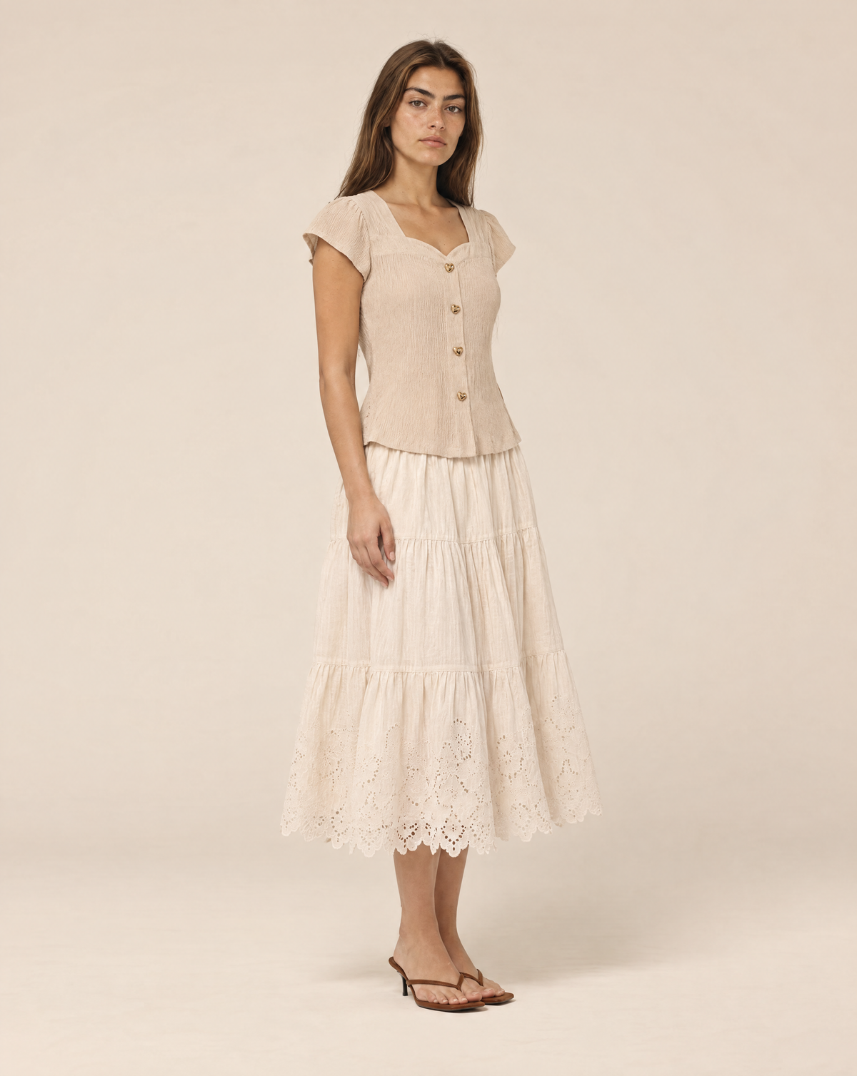 Blouse with gold buttons and short sleeves