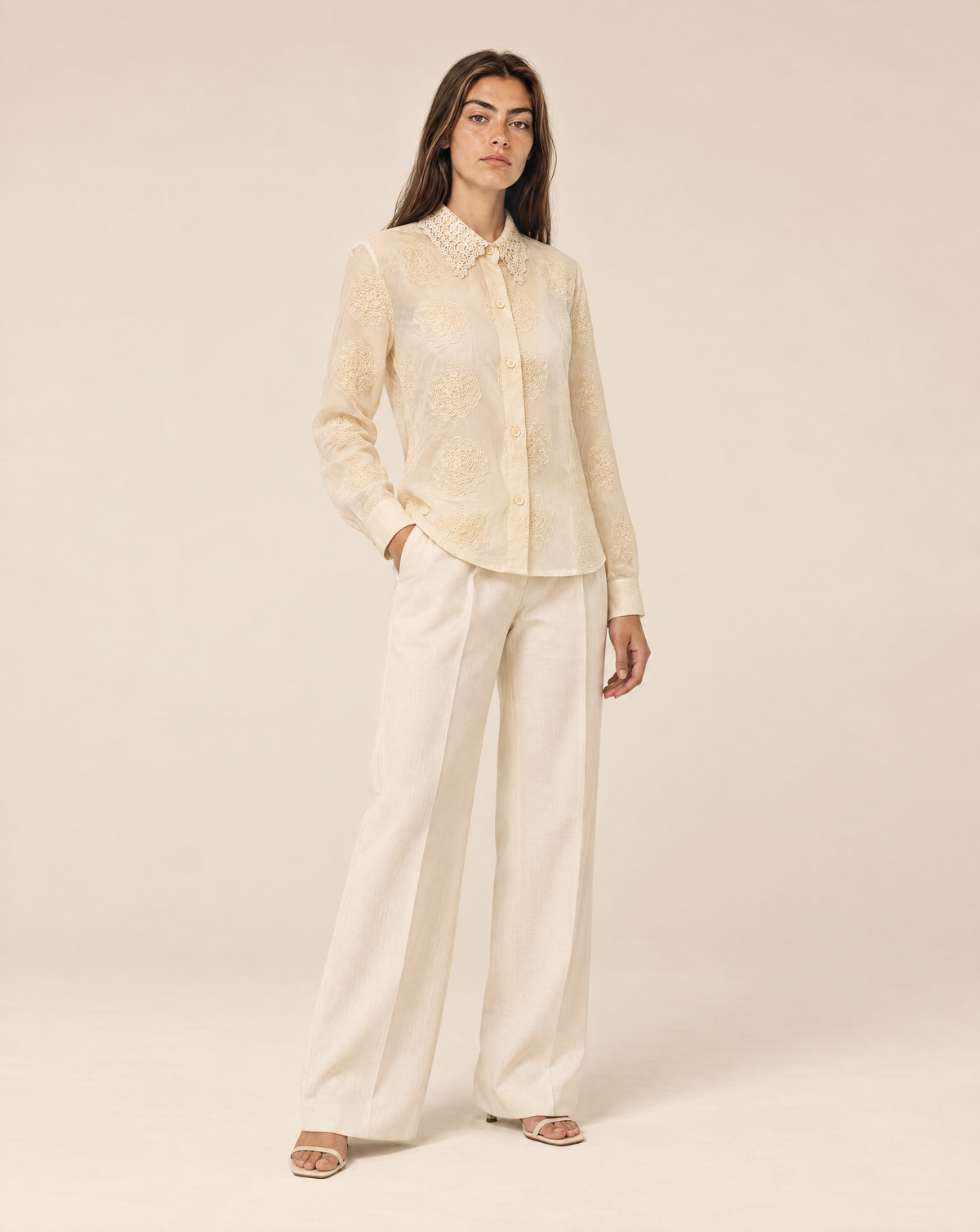 Embroidered women's shirt with raised flowers and a lace collar