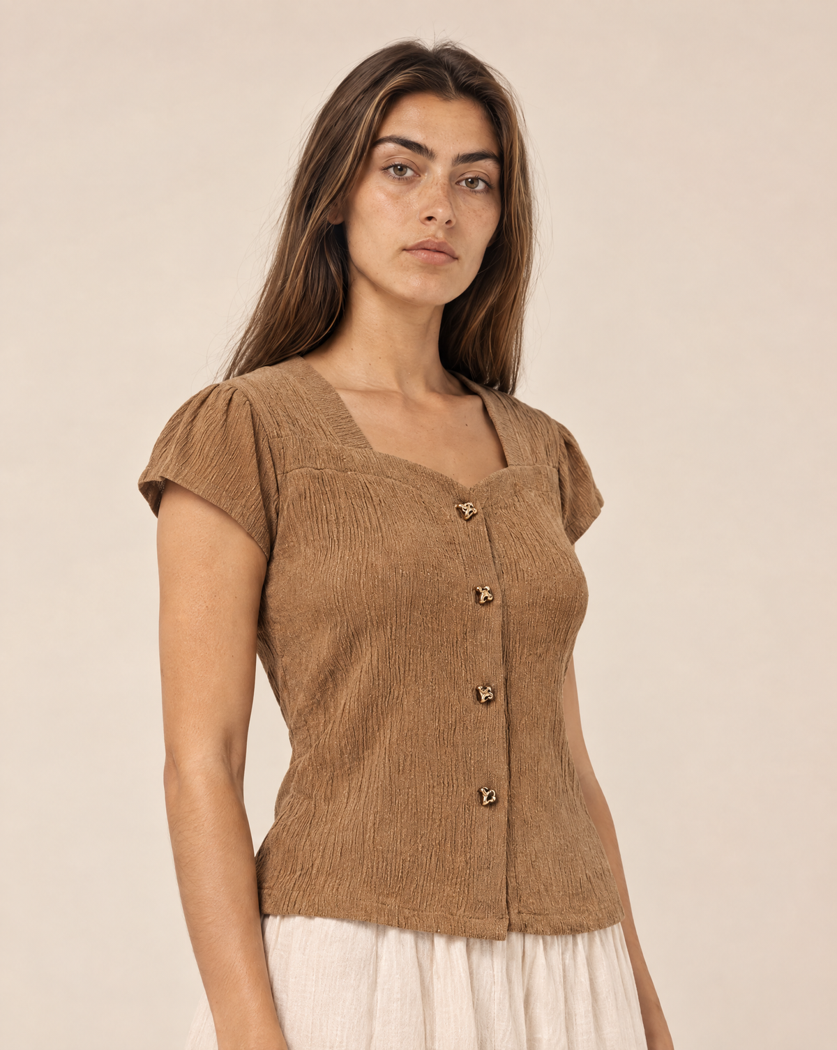 Blouse with gold buttons and short sleeves