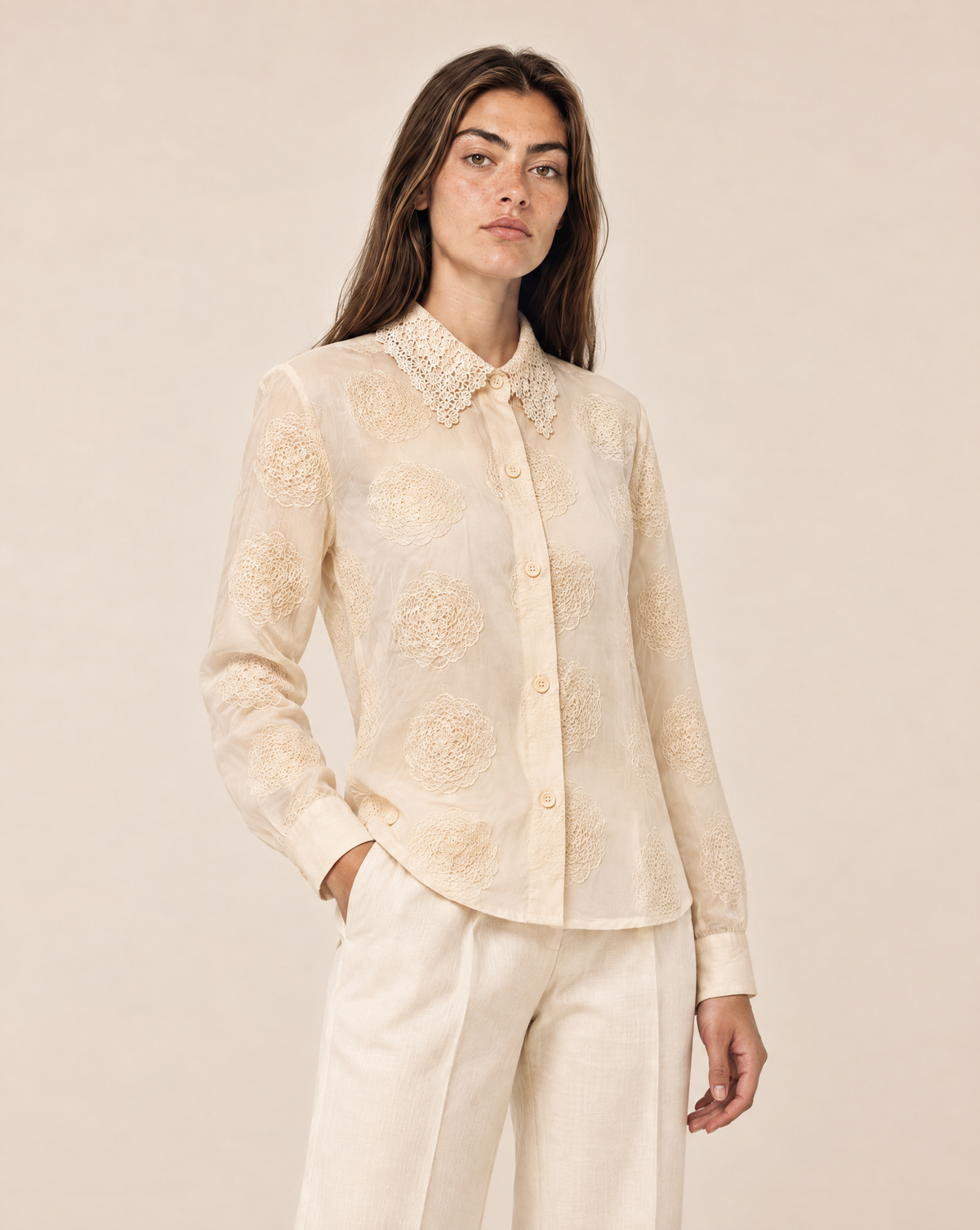 Embroidered women's shirt with raised flowers and a lace collar
