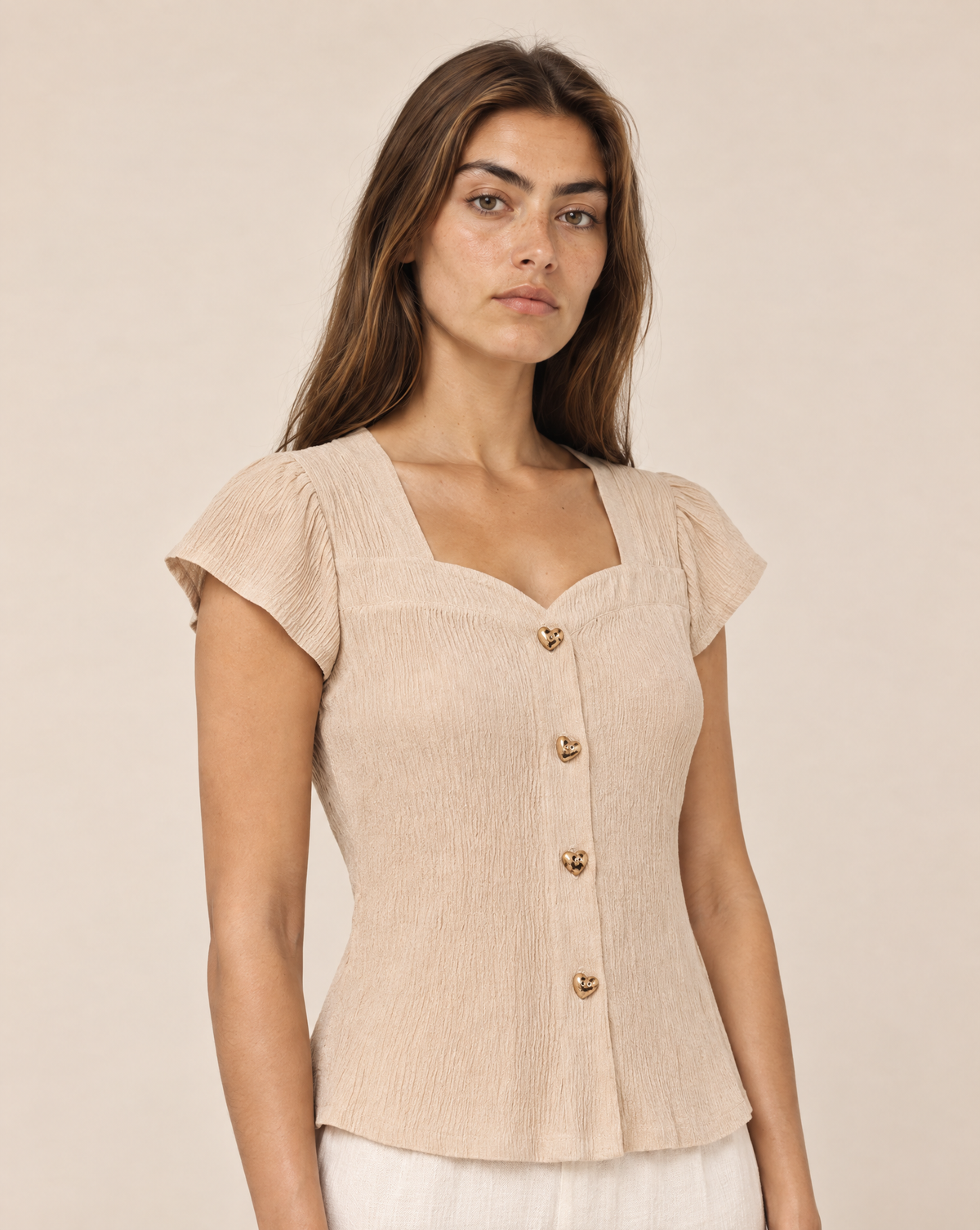 Blouse with gold buttons and short sleeves